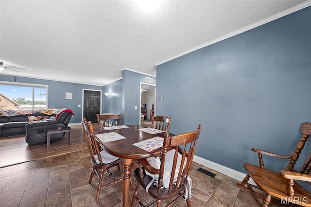 44 Viola Dr, Wright City, MO 63390 - dining space with a textured ceiling, crown molding, and ceiling fan