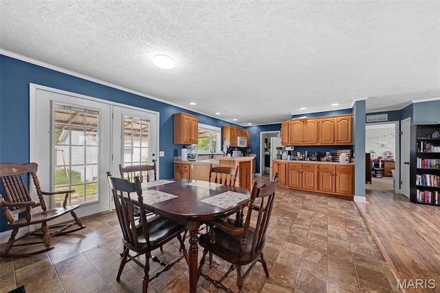 44 Viola Dr, Wright City, MO 63390 - dining room featuring ornamental molding, a textured ceiling, french doors, and recessed lighting