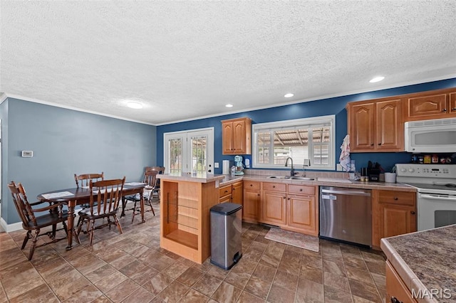 44 Viola Dr, Wright City, MO 63390 - kitchen with white appliances, a textured ceiling, recessed lighting, light countertops, and ornamental molding