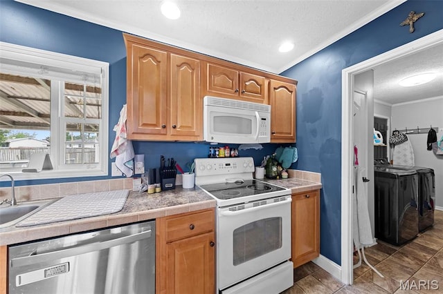 44 Viola Dr, Wright City, MO 63390 - kitchen with white appliances, independent washer and dryer, a textured ceiling, ornamental molding, and recessed lighting