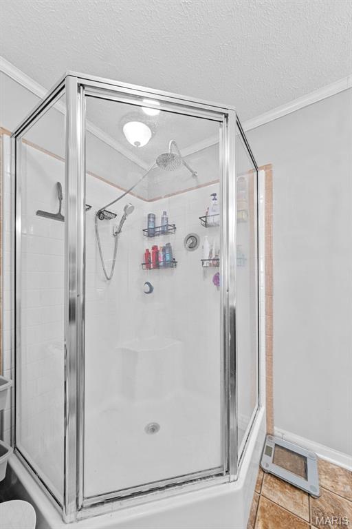 44 Viola Dr, Wright City, MO 63390 - full bath featuring ornamental molding, a textured ceiling, and a stall shower