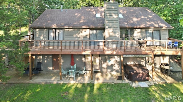 877 Red Fox Dr, Innsbrook, MO 63390 - back of house featuring a patio, a deck, a chimney, and a yard