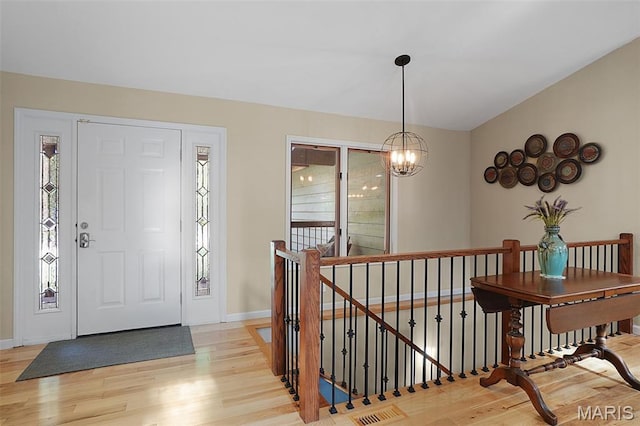 877 Red Fox Dr, Innsbrook, MO 63390 - entryway with light wood-style flooring and a chandelier