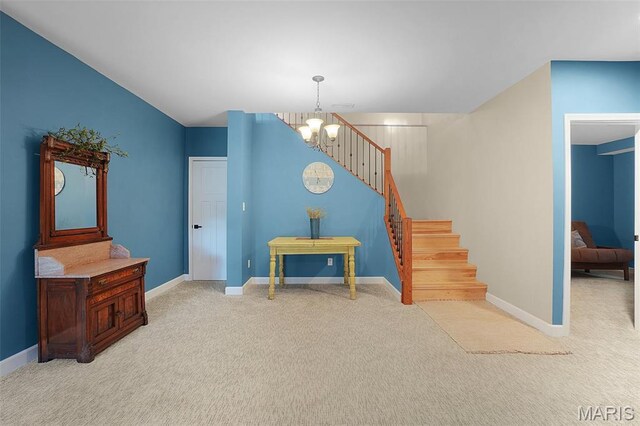 877 Red Fox Dr, Innsbrook, MO 63390 - stairway featuring a chandelier and carpet