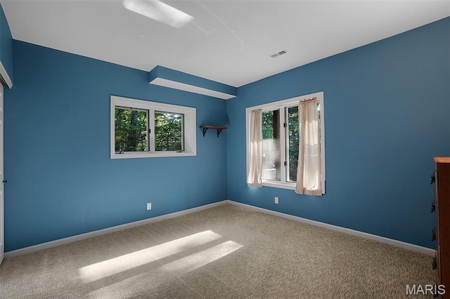 877 Red Fox Dr, Innsbrook, MO 63390 - empty room featuring carpet floors and plenty of natural light