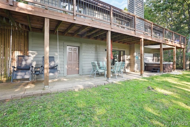 877 Red Fox Dr, Innsbrook, MO 63390 - rear view of property with a hot tub, a patio area, a wooden deck, a yard, and a chimney