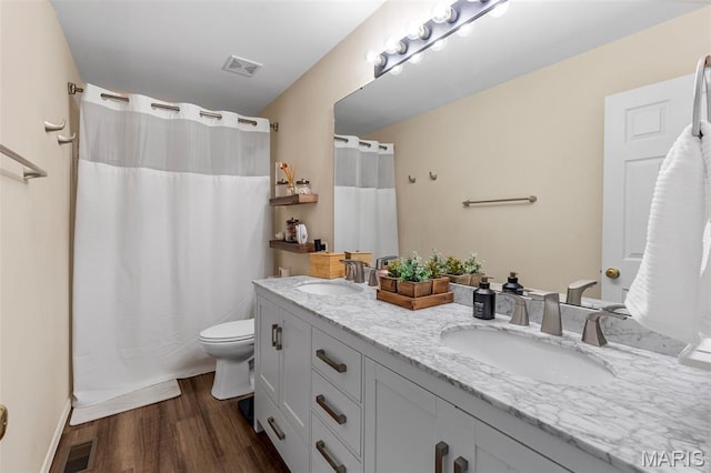 847 Boardwalk Springs Pl, Ofallon, MO 63368 - bathroom featuring double vanity, wood finished floors, and curtained shower