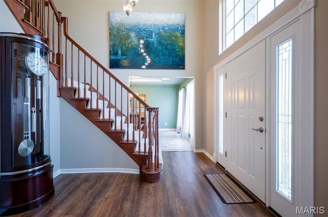 824 Legends View Dr, Eureka, MO 63025 - entrance foyer with a towering ceiling, stairs, healthy amount of natural light, and wood finished floors