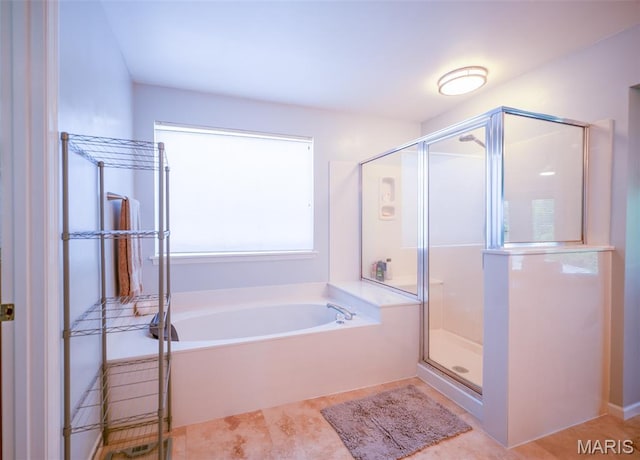 824 Legends View Dr, Eureka, MO 63025 - bathroom featuring a garden tub, a stall shower, and tile patterned flooring