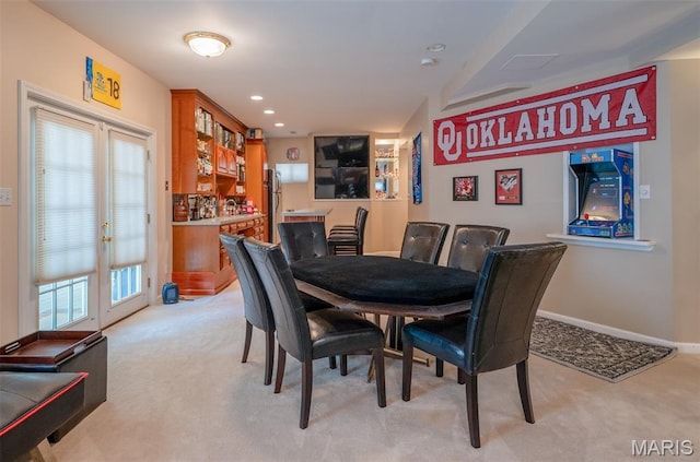 824 Legends View Dr, Eureka, MO 63025 - dining area with light colored carpet, french doors, and recessed lighting