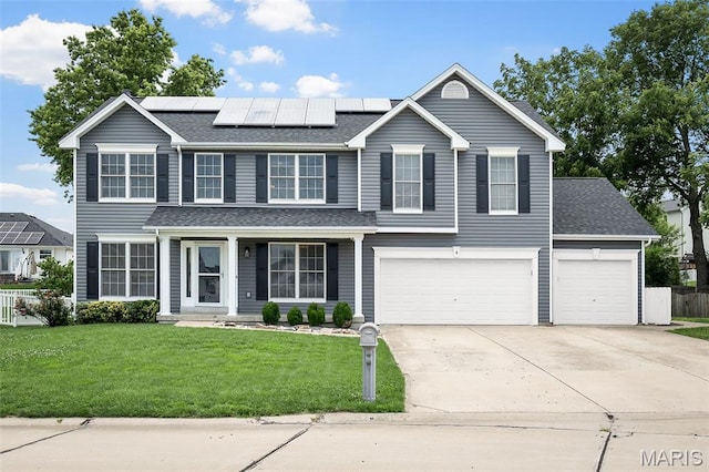 8 Dugout Ct, Ofallon, MO 63366 - traditional-style home featuring driveway, roof mounted solar panels, roof with shingles, and an attached garage