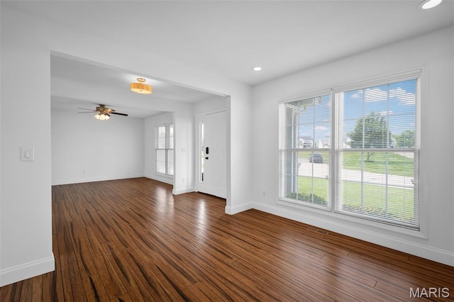 8 Dugout Ct, Ofallon, MO 63366 - unfurnished living room with dark wood-type flooring, ceiling fan, and recessed lighting