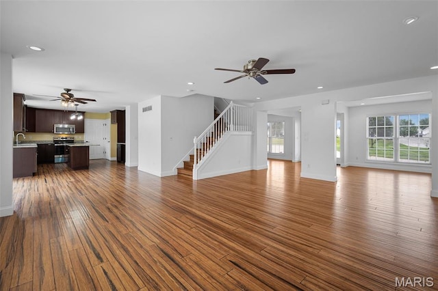 8 Dugout Ct, Ofallon, MO 63366 - unfurnished living room featuring a ceiling fan, healthy amount of natural light, dark wood finished floors, and recessed lighting