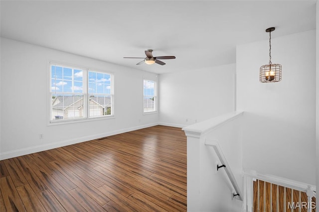 8 Dugout Ct, Ofallon, MO 63366 - empty room featuring a ceiling fan, wood finished floors, and a chandelier