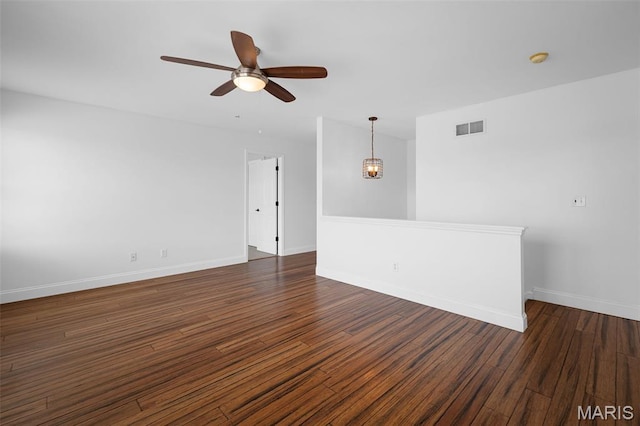 8 Dugout Ct, Ofallon, MO 63366 - spare room with ceiling fan, dark wood-style flooring, and a chandelier
