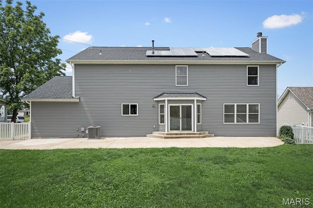 8 Dugout Ct, Ofallon, MO 63366 - back of house featuring a patio area, solar panels, a chimney, and roof with shingles