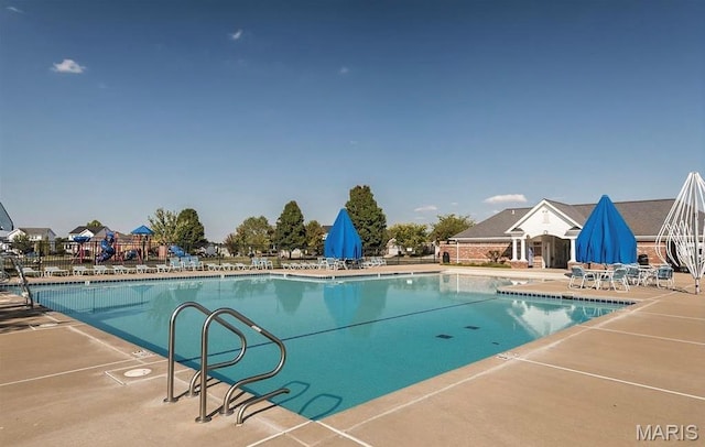 8 Dugout Ct, Ofallon, MO 63366 - community pool with a patio area
