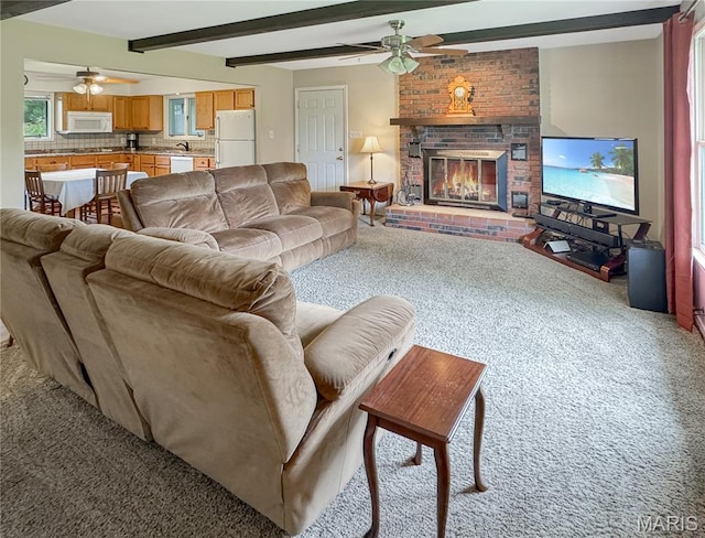 4423 Project Rd, Luebbering, MO 63061 - living room with ceiling fan, light carpet, beamed ceiling, and a brick fireplace