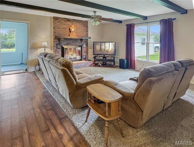 4423 Project Rd, Luebbering, MO 63061 - living room with hardwood / wood-style floors, beam ceiling, a ceiling fan, healthy amount of natural light, and a fireplace
