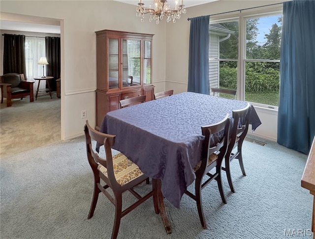 4423 Project Rd, Luebbering, MO 63061 - dining space featuring light colored carpet, a chandelier, plenty of natural light, and baseboards
