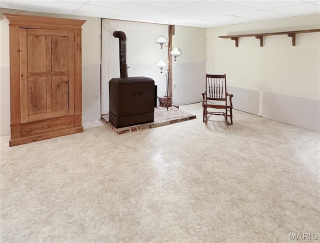 4423 Project Rd, Luebbering, MO 63061 - sitting room featuring a wood stove and a paneled ceiling