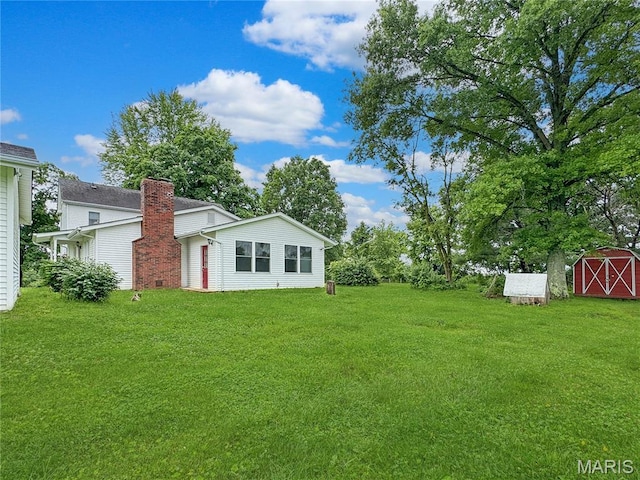 4423 Project Rd, Luebbering, MO 63061 - view of green lawn featuring a storage unit
