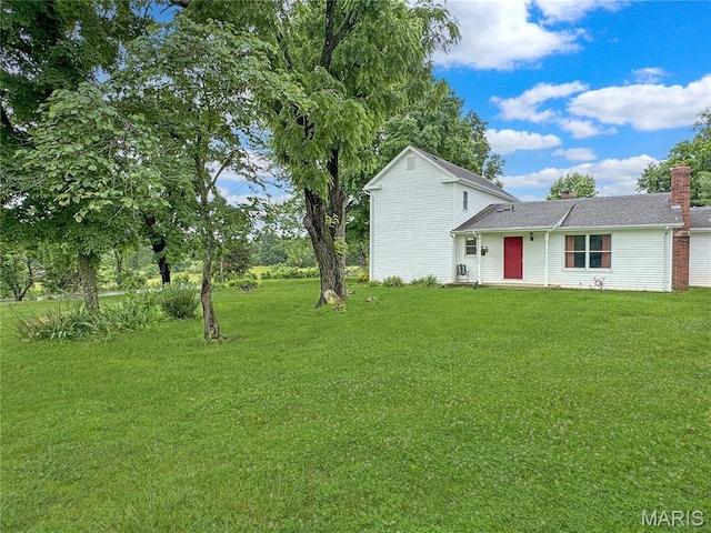 4423 Project Rd, Luebbering, MO 63061 - view of front of home featuring a front lawn and a chimney