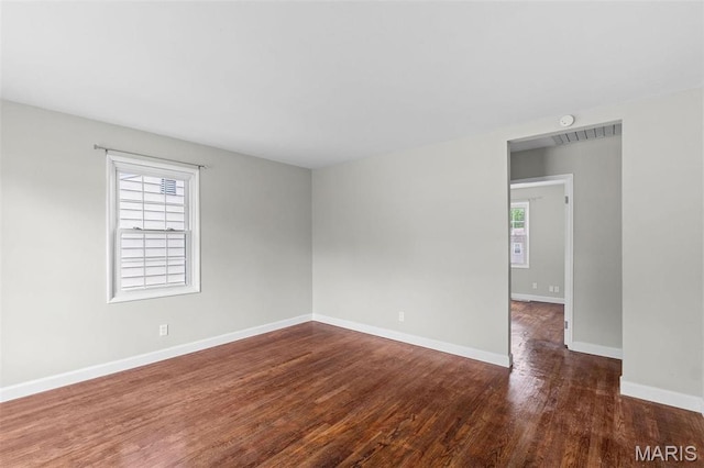 2490 Mullanphy Ln, Florissant, MO 63031 - spare room with plenty of natural light and wood finished floors
