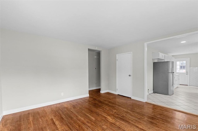 2490 Mullanphy Ln, Florissant, MO 63031 - unfurnished room featuring light wood-style flooring