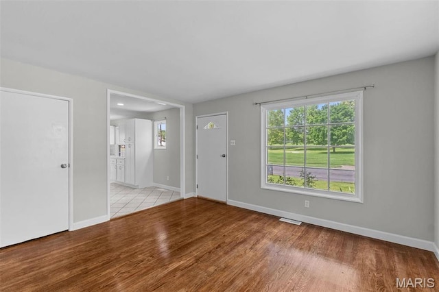 2490 Mullanphy Ln, Florissant, MO 63031 - foyer entrance featuring light wood finished floors and healthy amount of natural light
