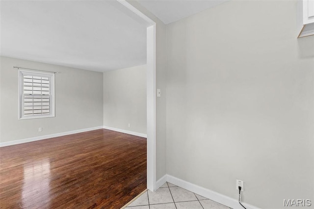 2490 Mullanphy Ln, Florissant, MO 63031 - spare room featuring baseboards and light wood finished floors
