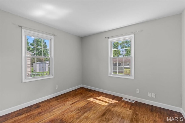 2490 Mullanphy Ln, Florissant, MO 63031 - empty room featuring baseboards and wood finished floors