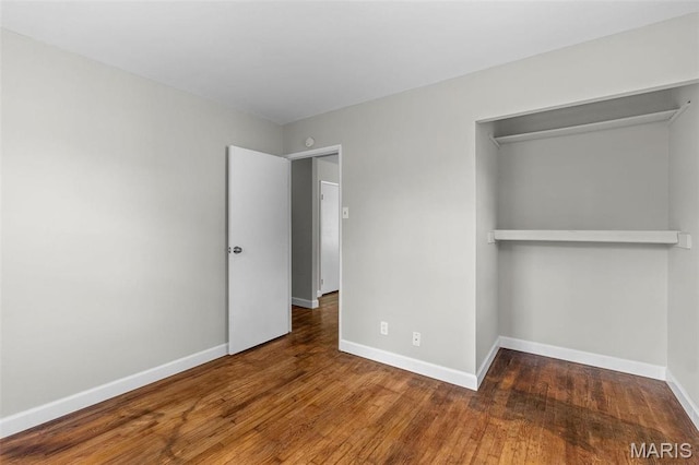 2490 Mullanphy Ln, Florissant, MO 63031 - unfurnished bedroom with wood finished floors and a closet