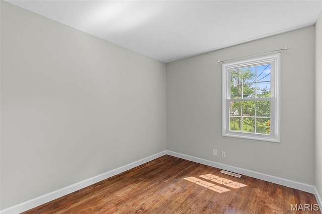 2490 Mullanphy Ln, Florissant, MO 63031 - empty room featuring baseboards and wood finished floors
