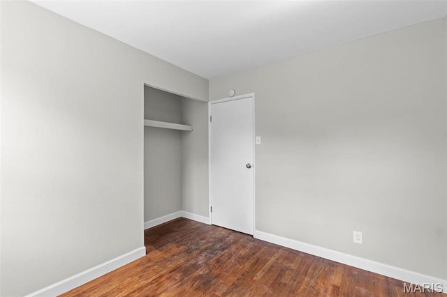 2490 Mullanphy Ln, Florissant, MO 63031 - unfurnished bedroom featuring a closet and wood finished floors