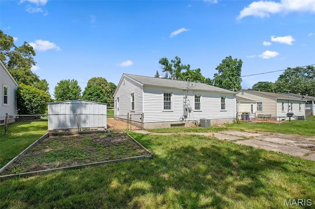 2490 Mullanphy Ln, Florissant, MO 63031 - back of property with a vegetable garden
