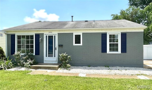 2490 Mullanphy Ln, Florissant, MO 63031 - single story home featuring a front yard, brick siding, and a shingled roof