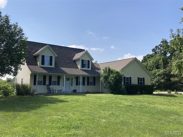 225 Country Crest Ln, Union, MO 63084 - new england style home with a porch, a front yard, and roof with shingles