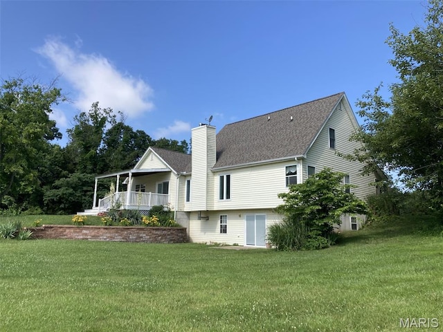 225 Country Crest Ln, Union, MO 63084 - back of property featuring a chimney, a shingled roof, and a lawn