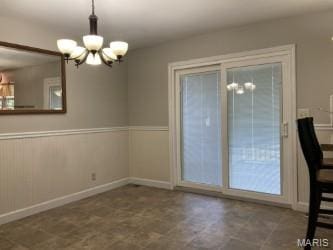 225 Country Crest Ln, Union, MO 63084 - unfurnished dining area featuring a chandelier and a wainscoted wall
