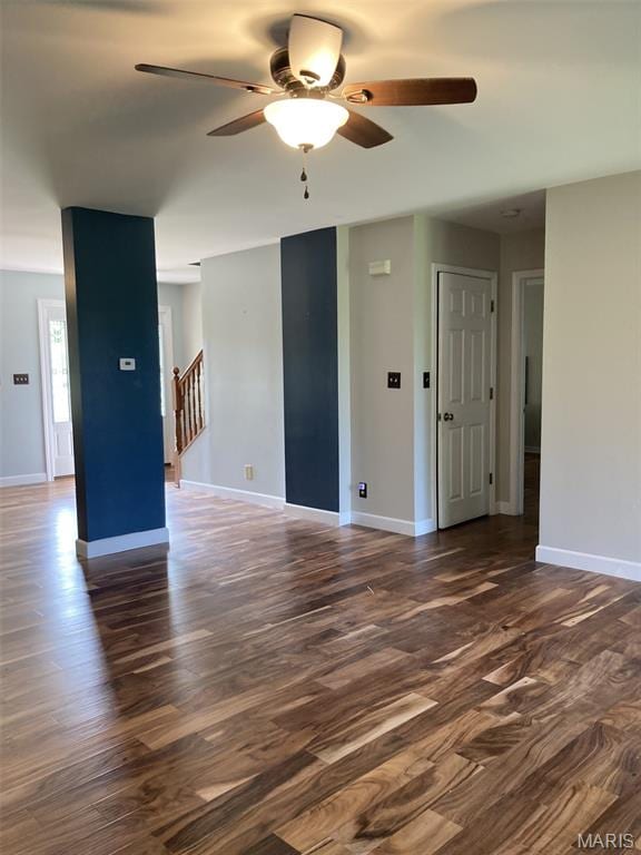 225 Country Crest Ln, Union, MO 63084 - empty room featuring dark wood finished floors, a ceiling fan, and stairway