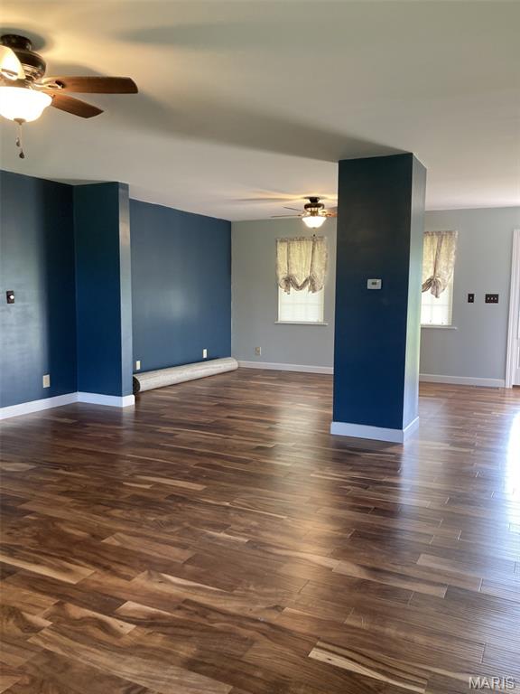 225 Country Crest Ln, Union, MO 63084 - unfurnished room featuring ceiling fan, plenty of natural light, and dark wood finished floors