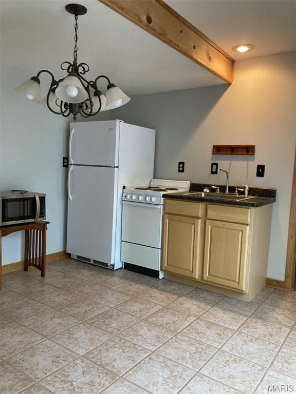225 Country Crest Ln, Union, MO 63084 - kitchen with white appliances, dark countertops, a chandelier, and light brown cabinets