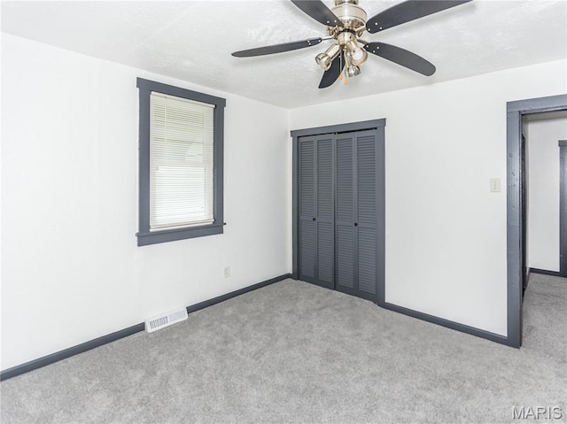 530 Poplar St, Highland, IL 62249 - unfurnished bedroom with carpet, a closet, and ceiling fan