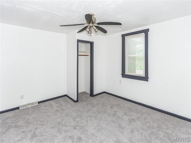 530 Poplar St, Highland, IL 62249 - spare room featuring carpet flooring and a ceiling fan