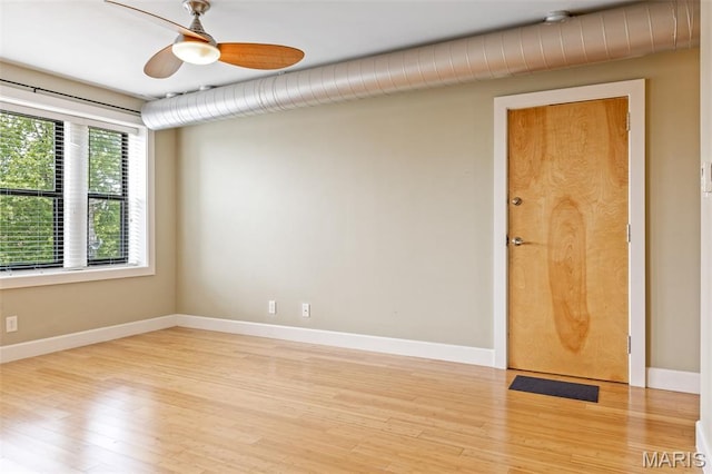 4220 Mcpherson Ave Unit 303, Saint Louis, MO 63108 - spare room with wood finished floors and a ceiling fan