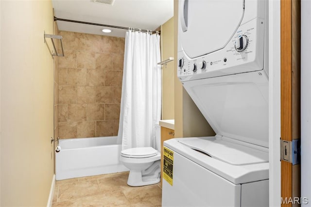 4220 Mcpherson Ave Unit 303, Saint Louis, MO 63108 - full bath with stacked washer and clothes dryer and shower / bath combination with curtain
