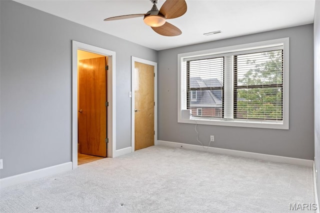 4220 Mcpherson Ave Unit 303, Saint Louis, MO 63108 - unfurnished bedroom featuring carpet and a ceiling fan