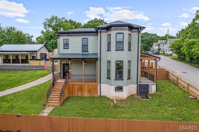 422 N 2nd St, De Soto, MO 63020 - view of front facade featuring a porch, brick siding, and stairs