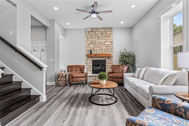 422 N 2nd St, De Soto, MO 63020 - living room with a ceiling fan, stairway, wood finished floors, a stone fireplace, and recessed lighting